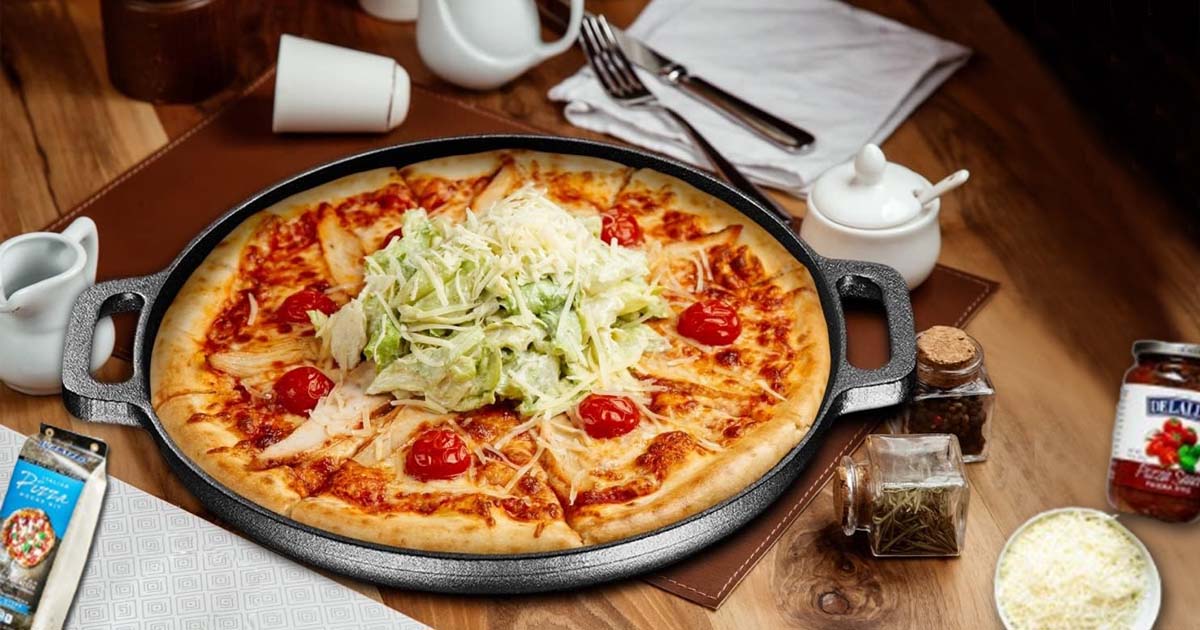 Delicious homemade cast iron skillet pizza with a crispy crust, melted cheese, and fresh toppings